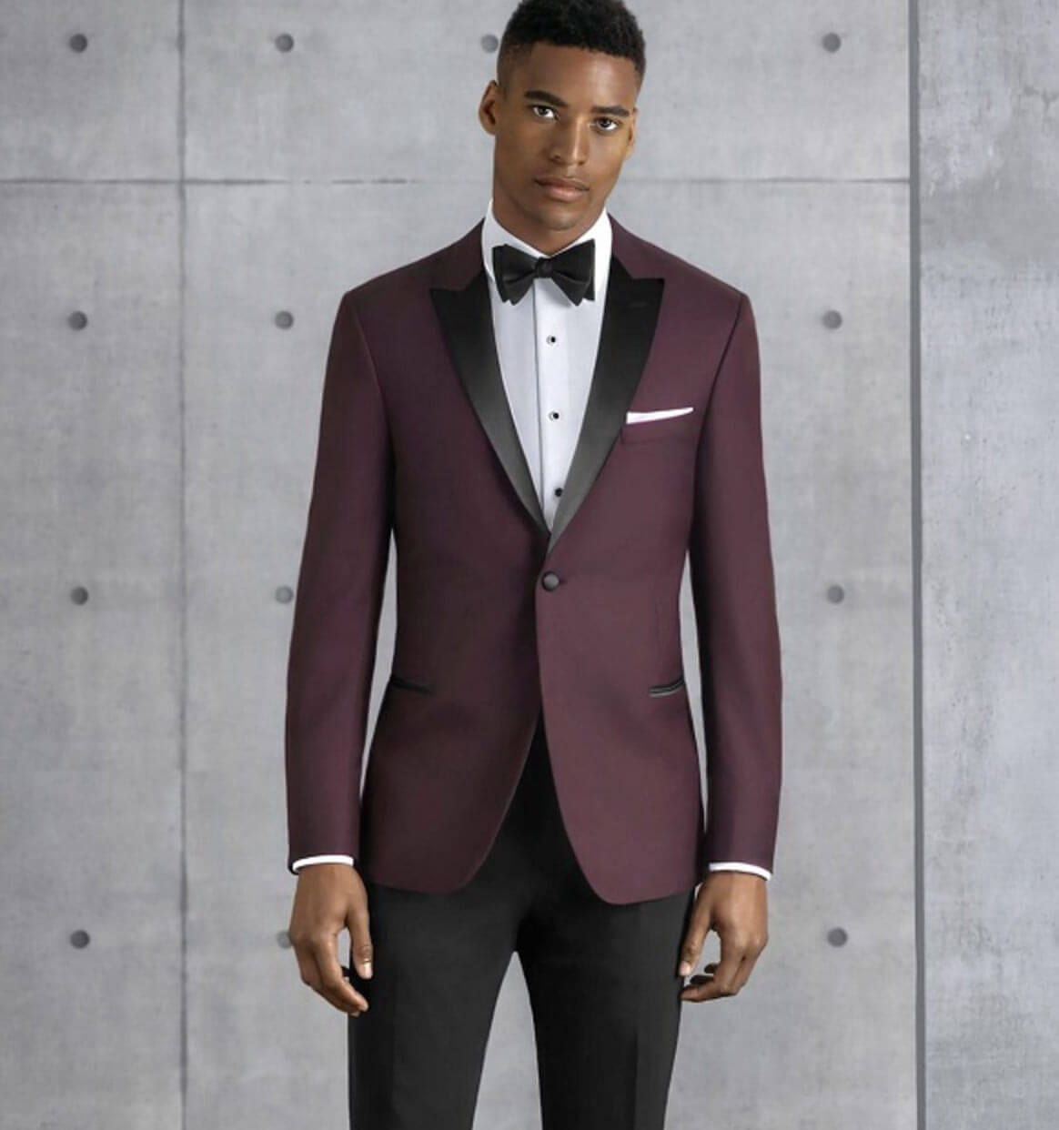 Model wearing a tuxedo suit